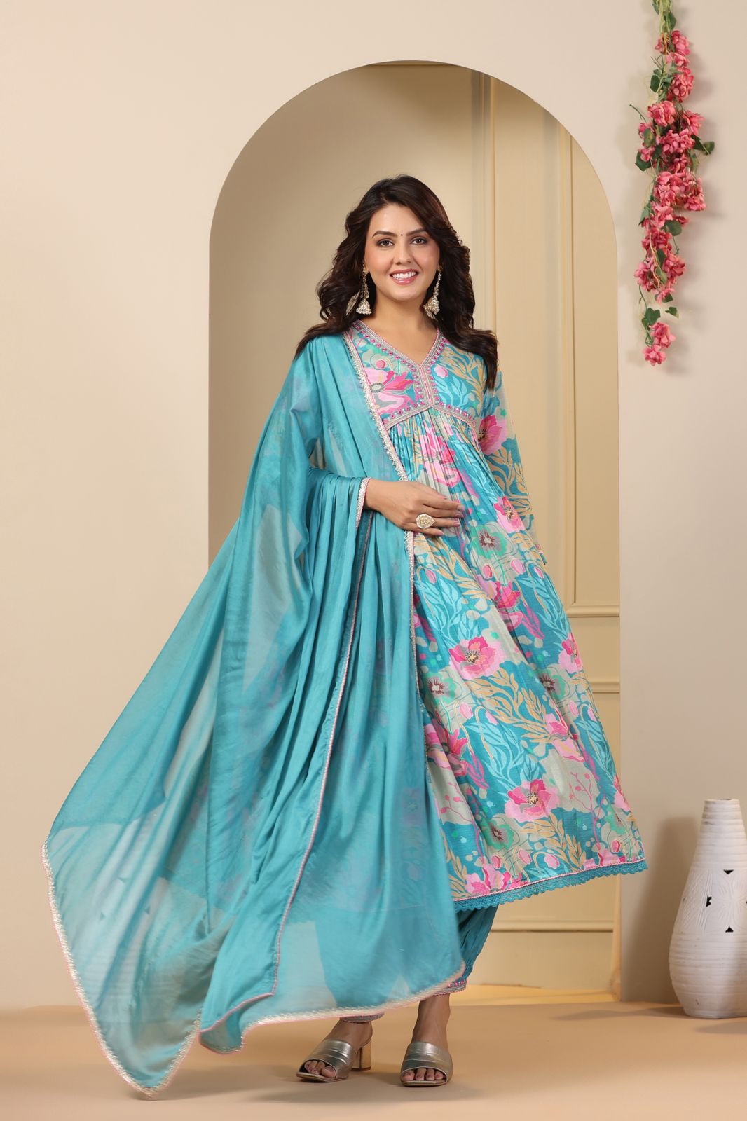 blue floral printed cape-style dress or gown with a long dupatta (scarf).
